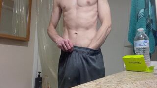 Horny fit guy plays with huge dick in bathroom big solo cumshot - porn video
